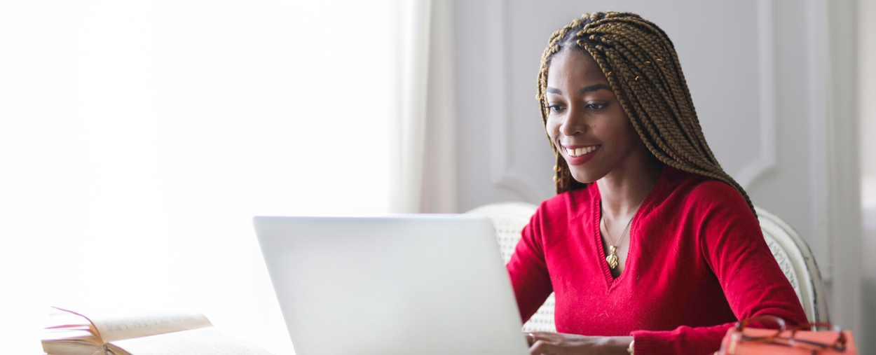 Woman working on her laptop at home.