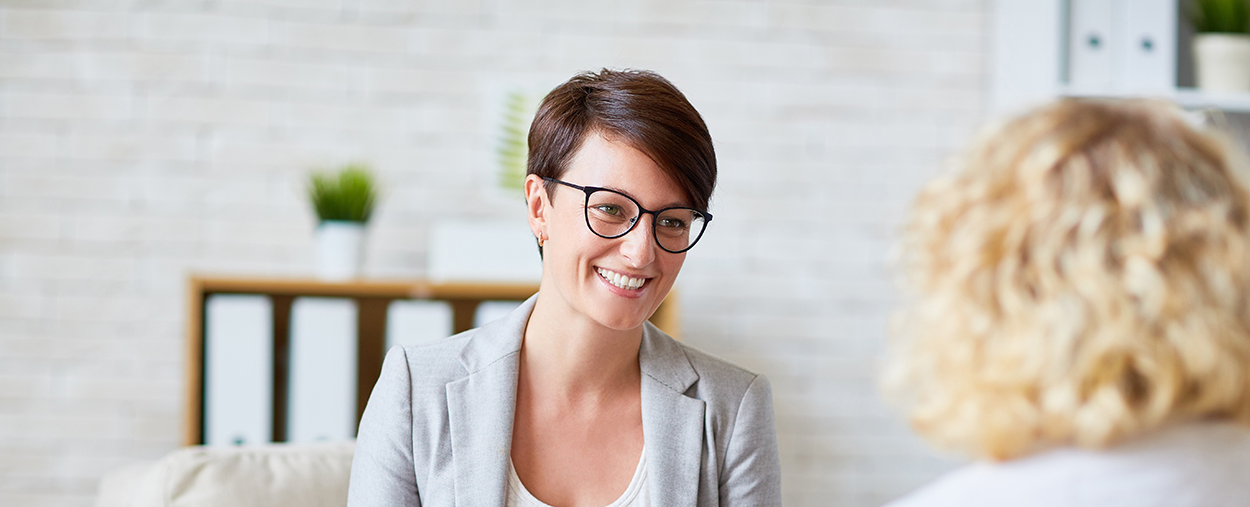 Image of a woman consulting with a counselor.