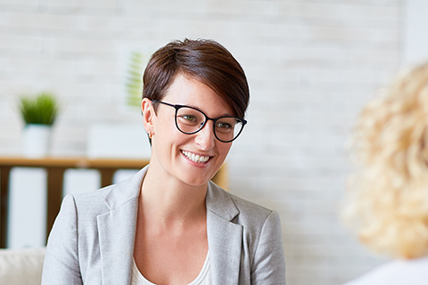 Image of a woman consulting with a counselor.