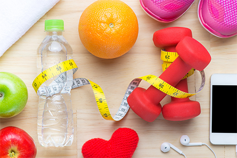 Image of water bottle, weight, towel and other exercise items