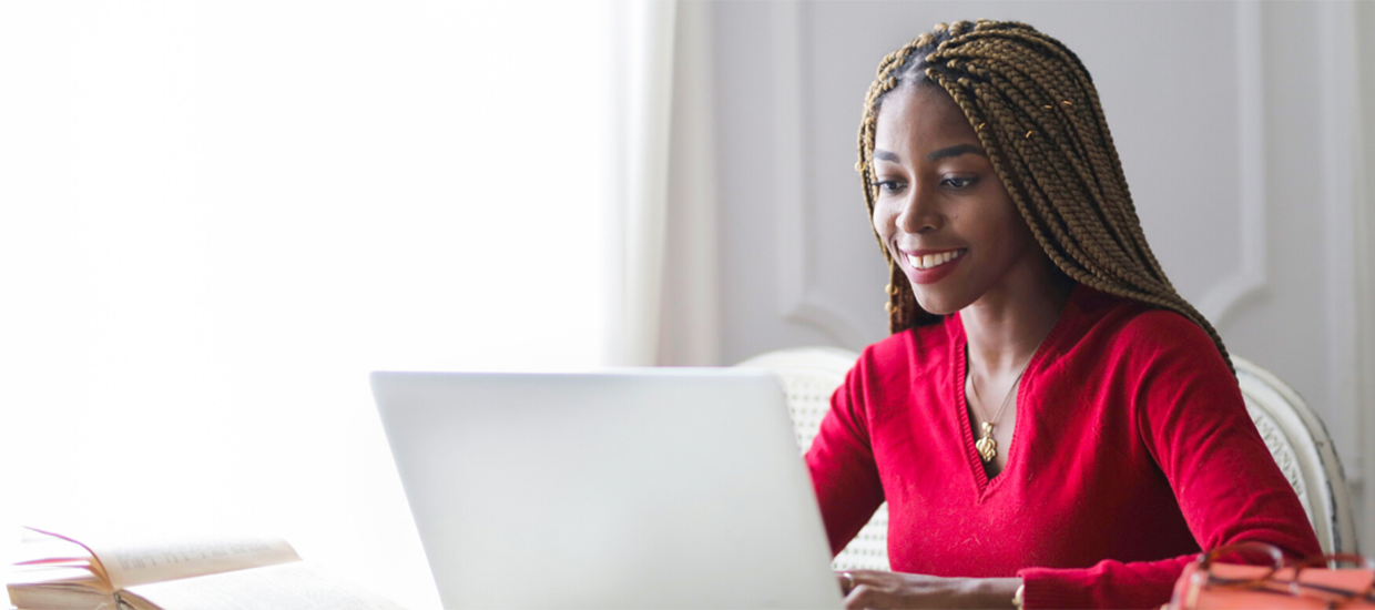 Woman working on her laptop at home.