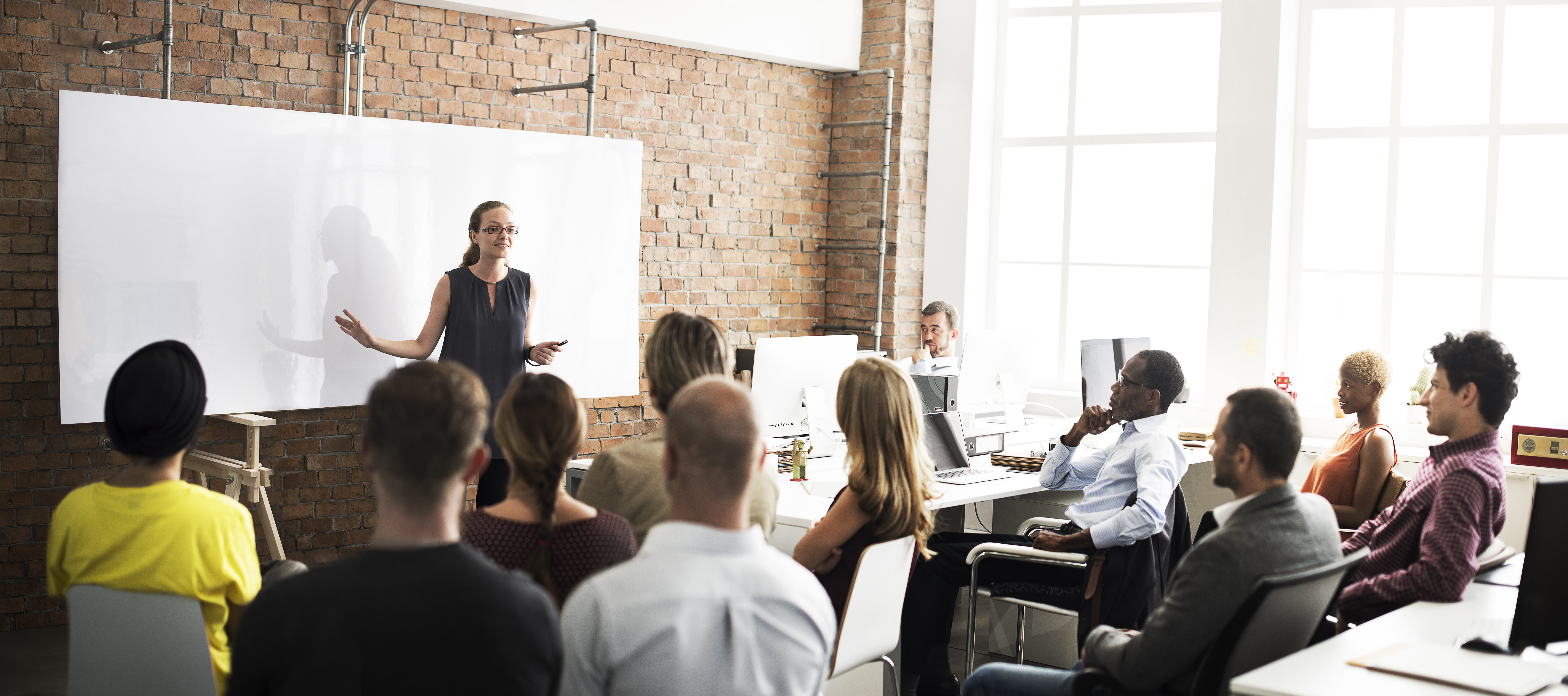 Image of a person conducting a seminar